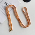 Detail of gold metal chain woven with orange leather strap and lobster clasps - Orange