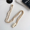 Detail of woven leather gold chain with pearl accents for bags and mobile phones - Pearl Crossbody Leather Chain / White