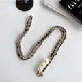 Detail of gold metal and black leather woven strap with three large pearls and lobster clasp - Pearl Crossbody Leather Chain / Black