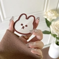 Handheld mirror surface rabbit phone grip holder with a brown border on white background - Brown