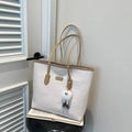 White embossed tote bag with cartoon patterns, brown handles and plush monster charm - Khaki With Pendant