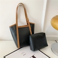 Grande set di borsa tote nera e marrone con pochette coordinata su una scrivania bianca - Set da 2 pezzi (Tote + Pochette interna) / Nero