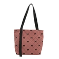 Pink corduroy tote bag with black bow lattice print and durable woven shoulder straps - Pink