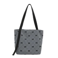 Gray corduroy tote bag featuring black quilted bow print and wide shoulder strap - Blue