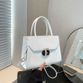 Minimalist white trapezoid handbag with T-shaped metal buckle and textured leather - White