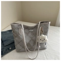 Macro shot of grey diamond-quilted canvas tote bag with a cute white cloud plush pendant - With Pendant / Gray