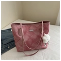 Detailed view of pink quilted tote bag with a white plush cloud charm on a strap - With Pendant / Pink