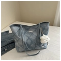 Detailed close-up of quilted denim tote bag featuring a cute cloud plush pendant - With Pendant / Blue