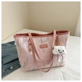 Detail of pink textured tote bag with wave embroidery and cloud plush charm - With Charm / Pink