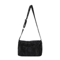 Minimalist black tote bag with unique pleated texture and adjustable strap on white background - Black