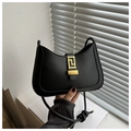Detail of black matte leather hobo bag with gold geometric buckle and knotted shoulder strap - Black