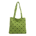 Green corduroy shoulder tote bag with black bow patterns and spacious interior - Green