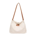 Minimalist beige woven hobo tote bag with brown leather handles and logo detail - Brown