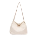 Cream woven tote bag with slim tan straps and a minimalist rectangular leather label - Khaki