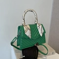 Green quilted shoulder bag with silk scarf handle and V-pattern stitching detail - Green