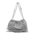 Grey pleated shoulder bag with metal chain strap and bow details on white background - Silver