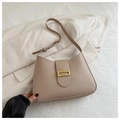 Detail of khaki PU leather bag with elegant golden rectangular metal clasp and adjustable strap - Khaki
