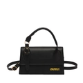 Minimalist black leather crossbody bag with gold hardware and top handle on white background - Black