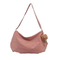 Pink minimalist crescent tote bag in nylon finish with cute plush charm accessory - Pink With Charm