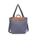 Minimalist canvas tote bag in grey-blue with brown leather accents and shoulder strap - Blue