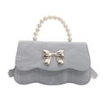 Light blue crossbody bag with pearl handle and silver bow detail on scalloped edge - Blue