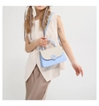 Detail of light blue and beige straw woven crossbody bag with circular buckle decoration - Blue