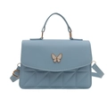 Minimalist light blue crossbody handbag for women with white butterfly buckle and quilting - Blue