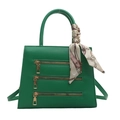Green trapezoidal leather handbag with three decorative zippers and silk scarf handle - Green