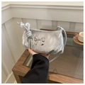 Detail of silver pleated shoulder bag featuring a 3D metallic bow and soft rope strap - Gray