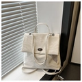 Detail of white wrinkled texture leather handbag with minimalist silver metallic twist lock - White