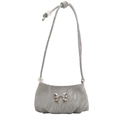 Gray mini shoulder bag with silver bow accent and ruffled texture on white background - Gray