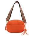 Orange lychee leather crossbody bag with bohemian patterned strap and tassel detail - Orange