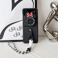 Detail of Galaxy Z Flip case with retro camera design, red bow, and checkered strap - Samsung ZFlip3 / Cartoon Bow Camera Kickstand Style (Black)