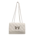 Classic white quilted crossbody bag with silver chain strap and metal bow detail - White