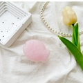 Detailed view of pink fish phone stand with semi-transparent matte finish on white cloth - Pink