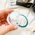 Detailed view of a clear magnetic phone grip featuring white and dark green accent rings - Magnetic Grip - Transparent Grooved Round