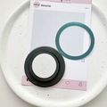 Detail of magnetic phone socket base with teal metallic ring on a decorative tray - Magnetic Grip - Black with Adhesive