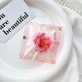 Detailed view of pink strawberry bread phone grip in cute Japanese style packaging - Pink (Strawberry Snack Bag)
