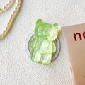 Detail of 3D aurora bear phone grip showing iridescent green finish and round adhesive base - Transparent Magnetic Stand-Silver Laser Bear-Green