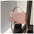 Detail of pink shoulder bag with bear patterns and gold metal bar buckle on flap - Pink