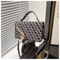 Detailed view of the diamond pattern and bear motif on this fashionable crossbody bag - Black