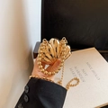 Pochette a conchiglia dorata lucida con manico di perle e tracolla per donna - Oro