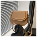 Detail view of the vintage brown saddle bag with fine stitching and golden metal hooks - Khaki