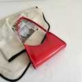 Glossy bright red patent leather baguette shoulder bag in a retro minimalist hobo style - Red