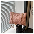Detailed view of pink quilted tote bag with diamond pattern and gold chain strap - Pink