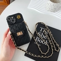 Black leather iPhone case with mini quilted pouch and long gold metal chain strap - Black / iPhone 15 Pro Max