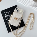 Quilted cream phone case for iPhone with camellia lock and crossbody gold chain strap - Apricot / iPhone 15 Pro Max