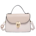 Tweekleurige beige crossbodytas met goudkleurig rond slot en zwart handvat detail - Khaki & Wit