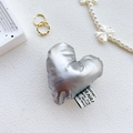 Close-up of metallic silver heart phone grip with textile texture and side woven label - Silver