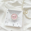 Detailed macro view of pearl-edged phone grip with silver bow on a marble tray - Metal Bracket - Round Pearl Bow / Pink